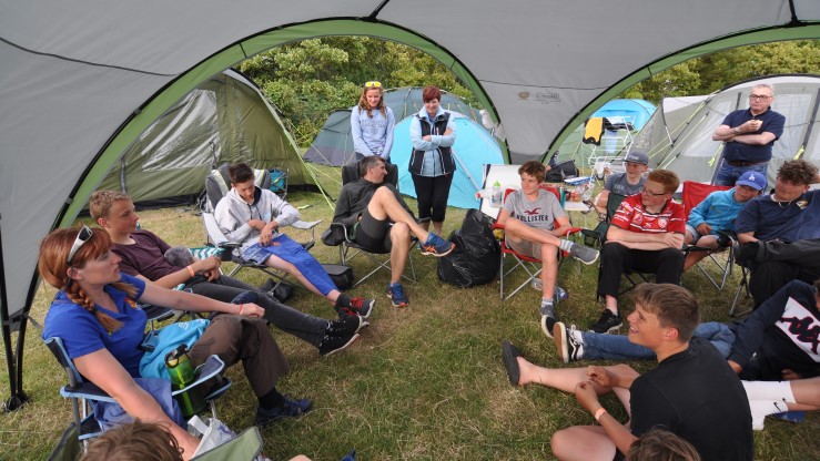 Instructor Emily Castle from Banbury SC, pictured left debriefing the Northants NSSA (National School Sailing Association) team at event campsite.