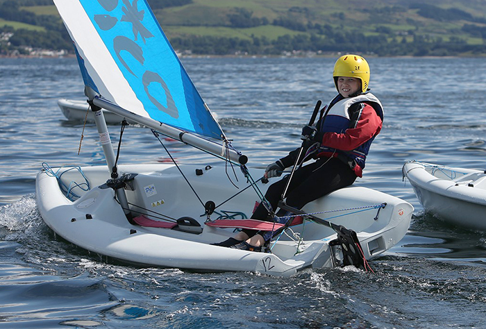 A young sailor onboard a Pico dinghy