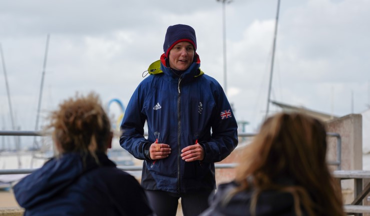 Ali Young on shore coaching a session while taking the RYA Race Coach Level 2 course, WPNSA.