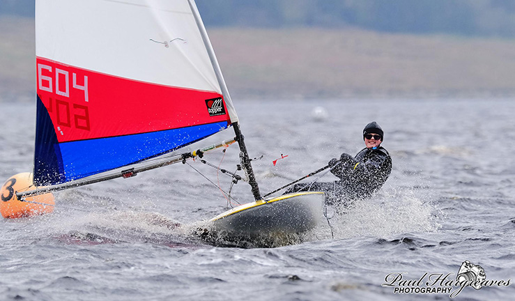 Junior sailors launching with help from parents at NEYYTS event, Yeadon SC, 2022