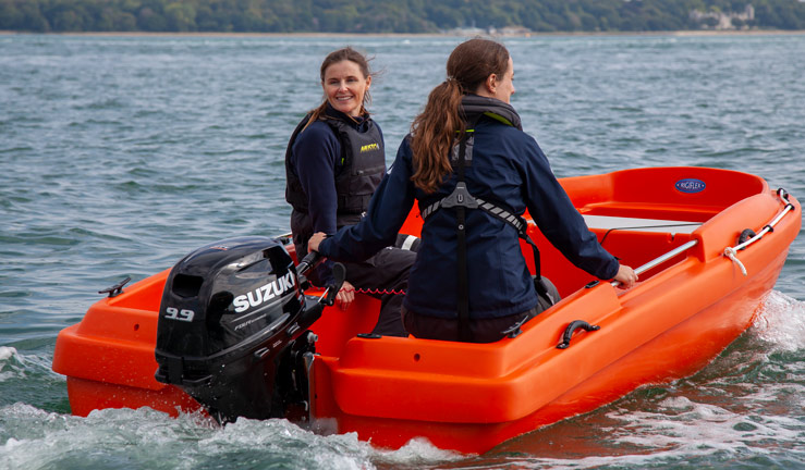 RYA and Suzuki Safety Boat competition. 2 women in Suzuki powered safety boat