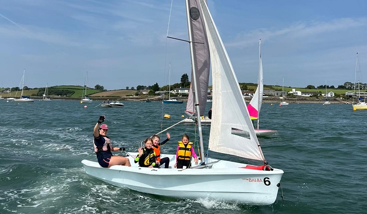 Children learning to sail in a laser Bahia on Whiterock Bay, Northern Ireland