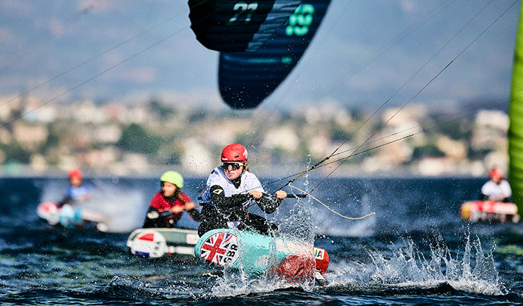 wide-shot of dynamic kite foiler on the sea