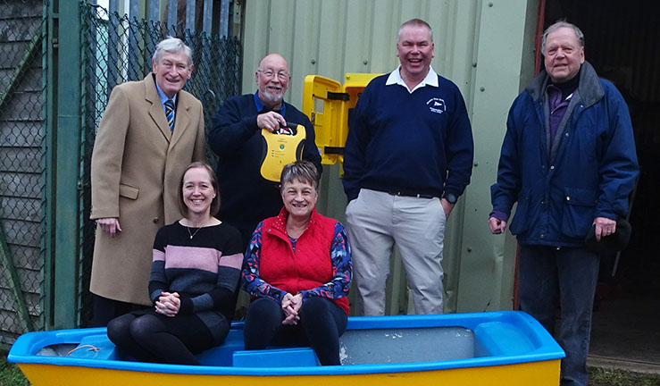 Chairman of national charity RALPHH, Richard Allen, presents defibrillator to Middle Nene SC Commodore Tony Wright along with club committee members.
