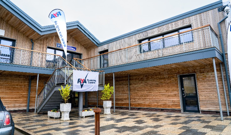 The exterior of the Marine Academy building, with RYA Training Centre flag.