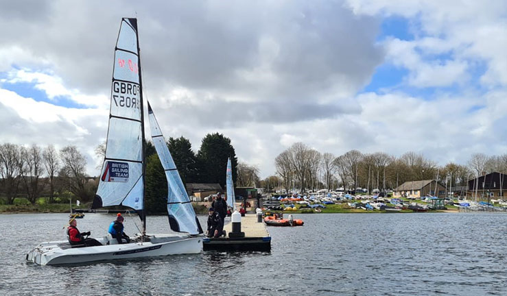 RYA Midlands training team day at Rutland SC, team members in a SKUD keelboat on a pontoon.