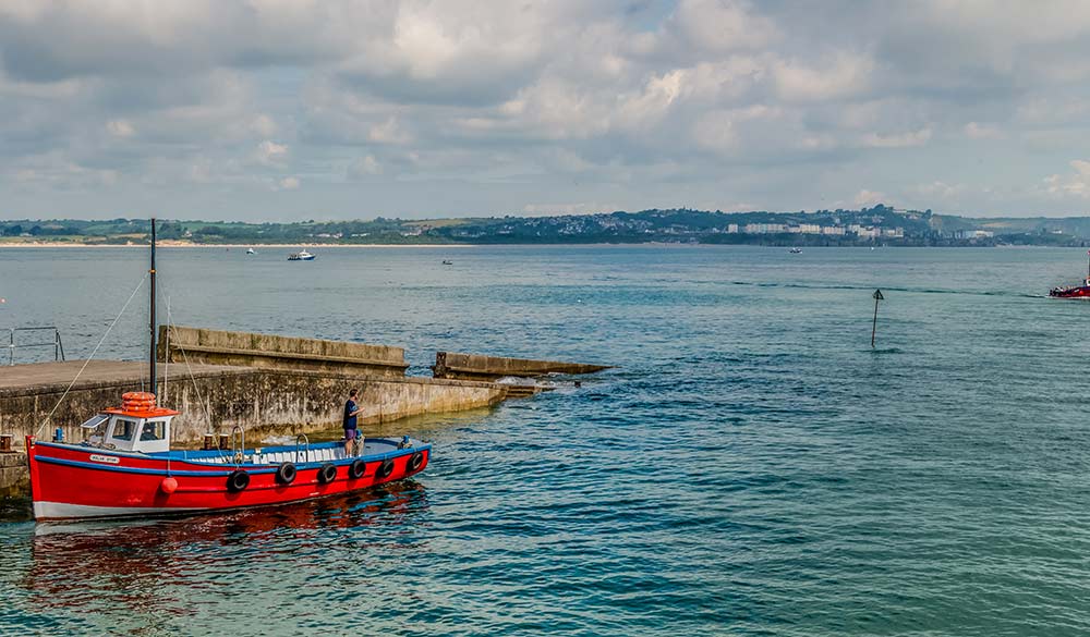 Wide shot of boat moored in West Wales