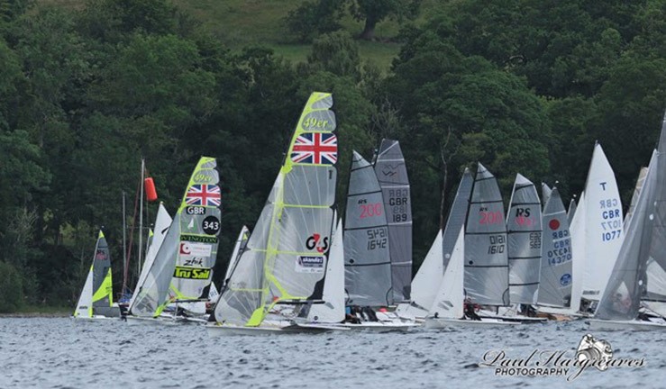 Topper sailor racing in the foreground with variety of other colourful junior dinghy classes in the background at the Regional Junior Championships, Bassenthwaite 2023.