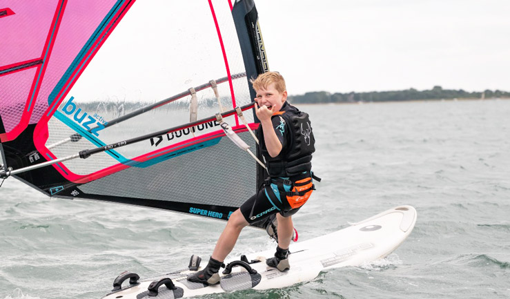 Boy windsurfing