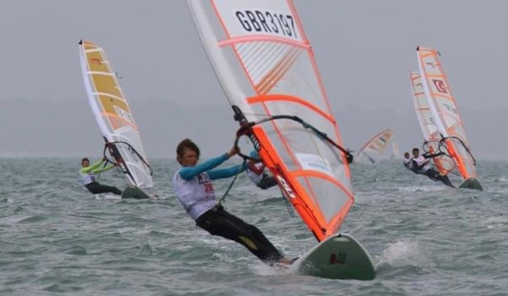 Boy windsurfing