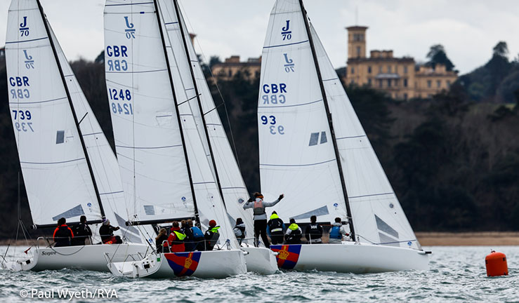 Four J70s from the Royal Southern YC fleet racing in the Solent with Osborne House on the Isle of Wight in the background.