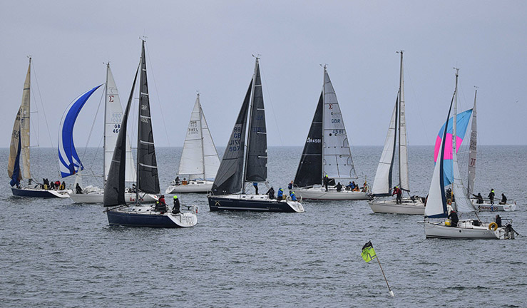 Fleet of around 9 yachts on the North Sea on a grey day for a race with the North East Cruiser Racing Association.