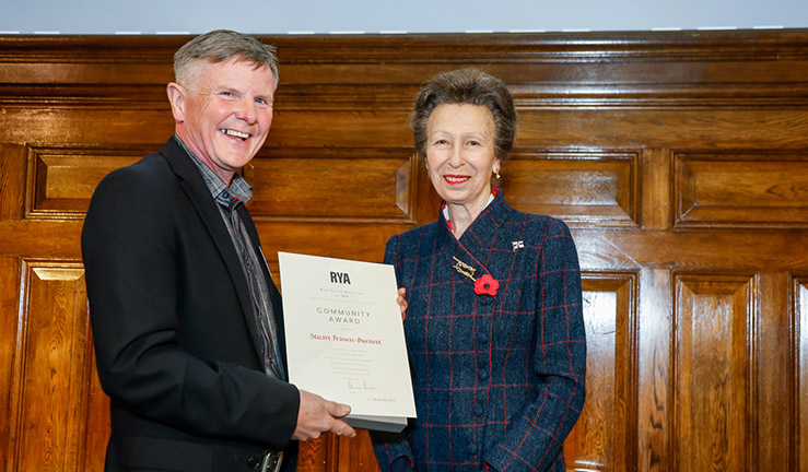 Chris Wright  is presented with an RYA Volunteer Award by HRH The Princess Royal.