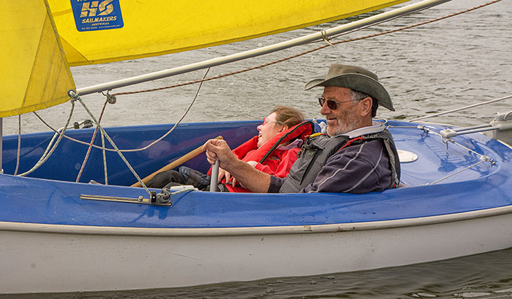 Group of around 20 juniors smiling on the jetty at Gresford Sailing Club.